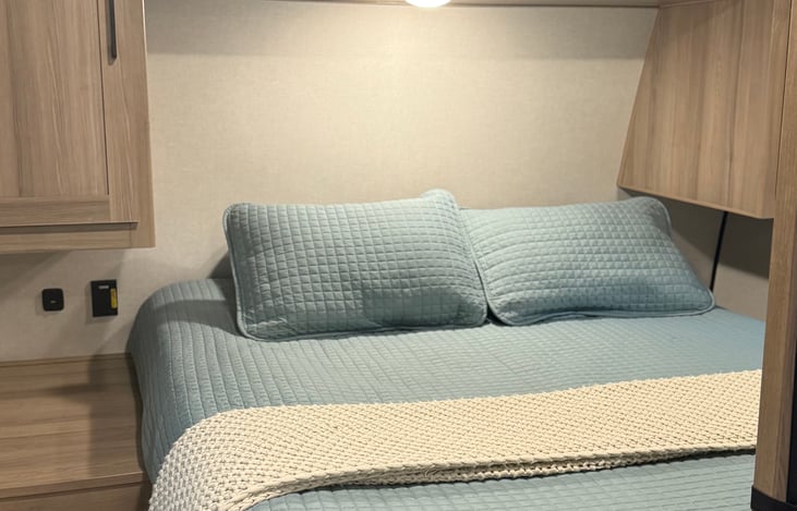 master bed w/ foam topper, door, hangers in side closets, phone plug ins