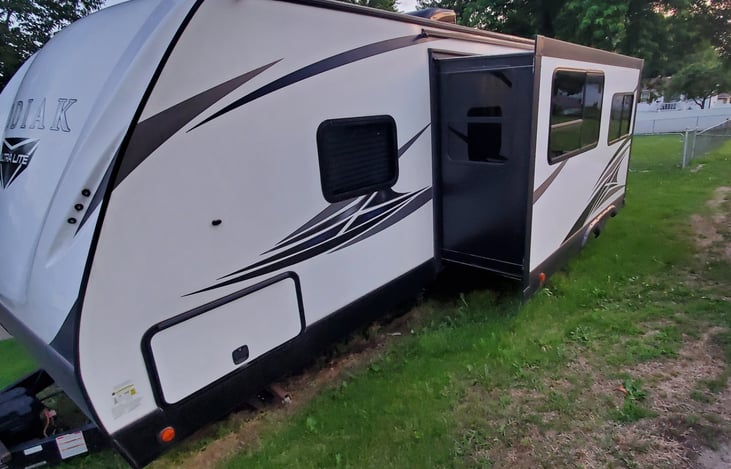 Slide out extended. Front storage is lockable and goes all across front with access on both sides.