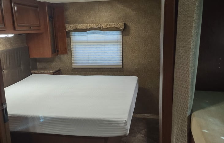 view of rear bedroom from bunk/bath hallway