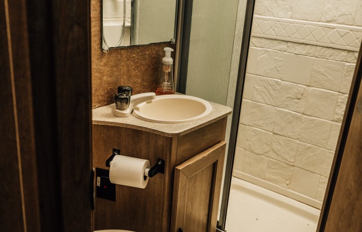 Bathroom includes shower, sink, and toilet.