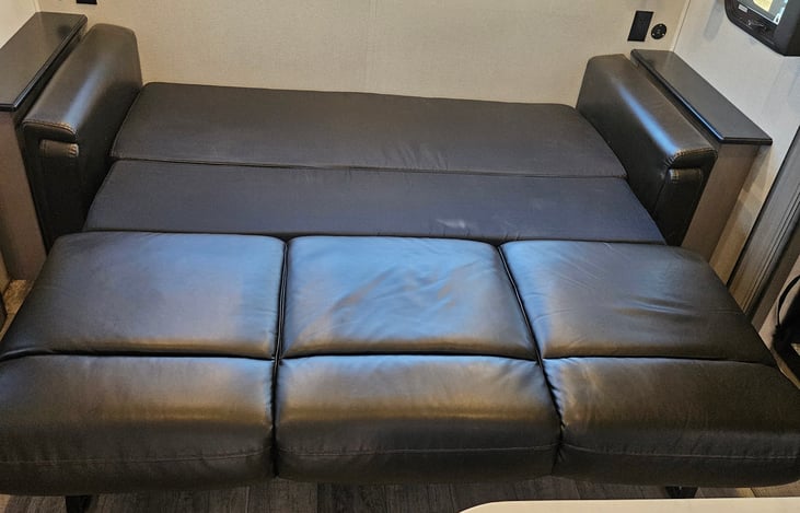 Couch layed out for queen bed