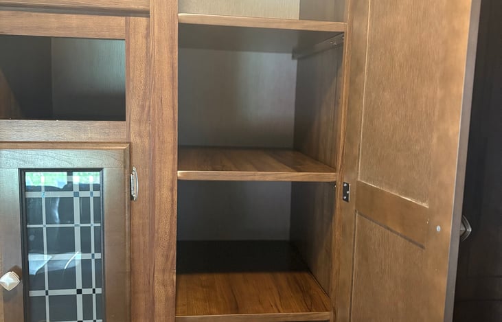 Great storage and closet space in the entertainment center area