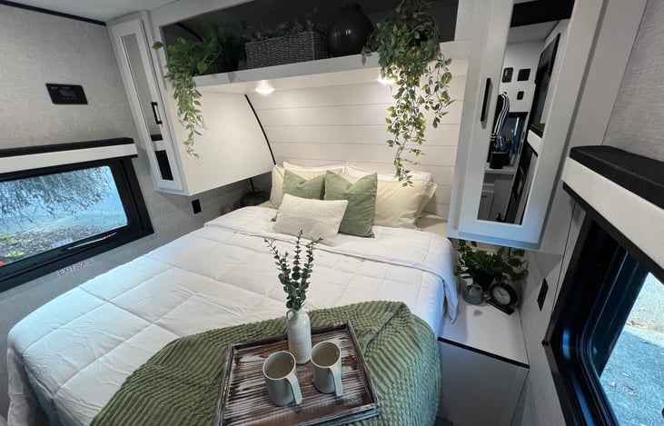 RV Queen bed with memory foam mattress and storage underneath.