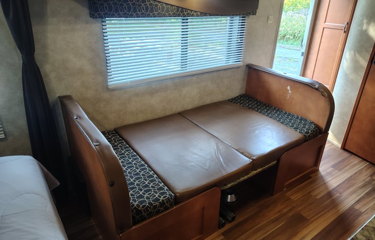 Dinette converts into a bed. Sleeps one adult or two kids comfortably.