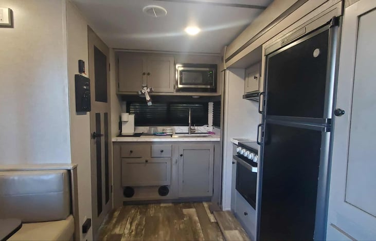 Kitchen slide out with a deep full size sink in the kitchen