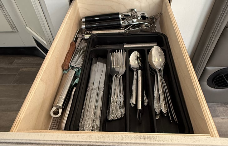 Full service of silverware, can opener and paring knife.