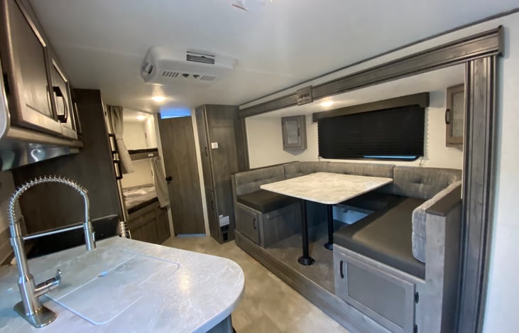 6-person kitchen dinette that can covert into a queen sleeping area