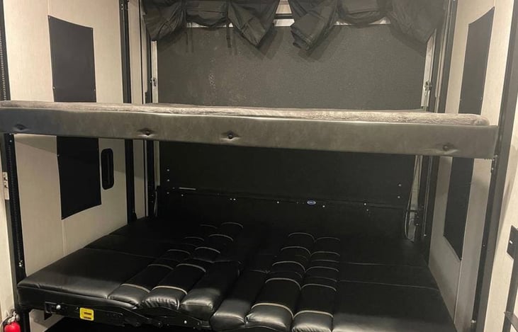 Garage with beds folded down.