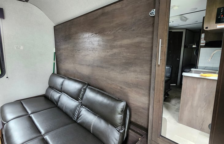 Murphy bed fold down over couch.
Queen size bed