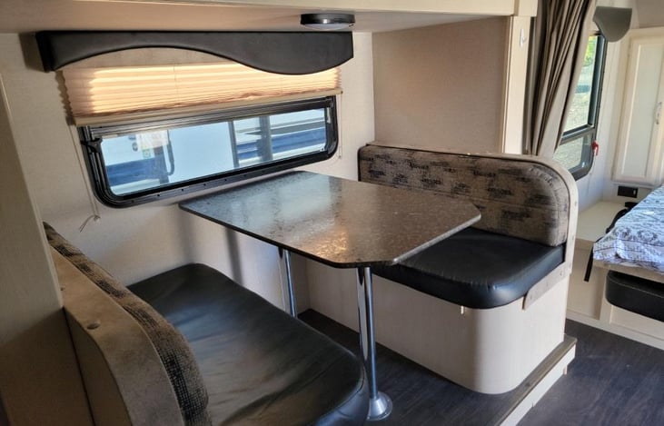 2 comfortable benches inside the dining slider. The table and cushions can be converted into a 1-2 person bed.