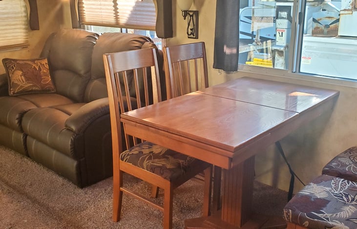 The dining table with chairs.