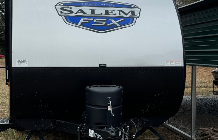 Front of camper, please note there is an electric jack now.