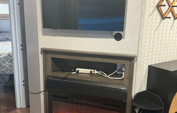 TV, power supply and fireplace