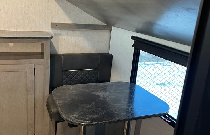 Kid's table in bunk room. Folds into bed with additional bunk that folds up and out of the way.