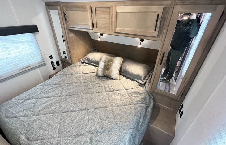 Master bedroom with queen sized bed, comfortable foam mattress, reading lights, USB charging station