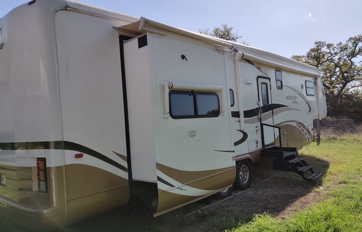 side with porch and stairs