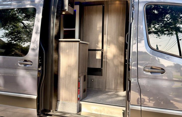 Power sliding door, hit a button on your remote, gently pull the door handle on the outside or hit 1 of 3 interior buttons and the door automatically opens