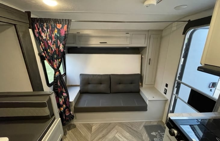 Added this again to continue about the wardrobe on the right. Can hold hanging shirts and coats. Great for diapers as well (we have littles). Black fixtures on the wall are USB and wall outlets.