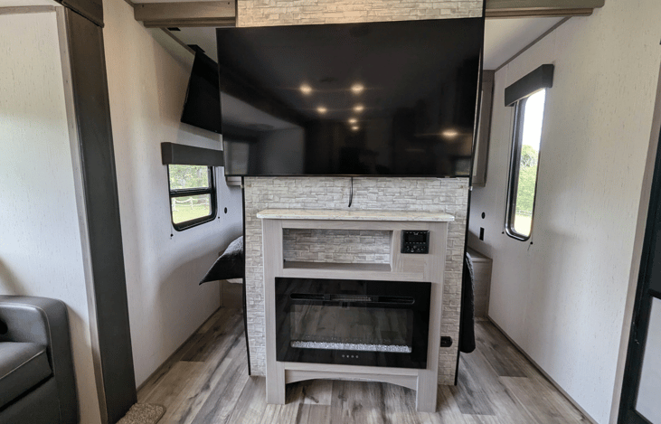 Bright, spacious and modern interior with large, well-equipped kitchen. Features two large slide-outs, ample storage throughout, electric fireplace, large TV, private bedroom, rear bunkhouse and more.