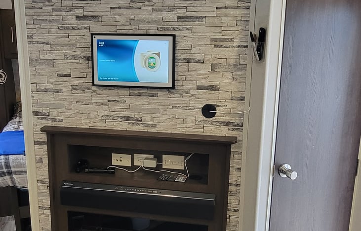 Electric fireplace and Bluetooth sound bar.