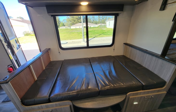 Table folds down to provide additional bedding.