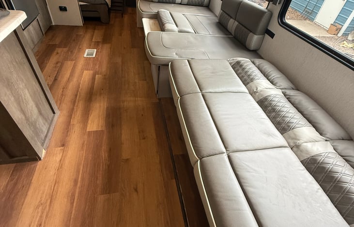 Couch and dinette collapsed for sleeping