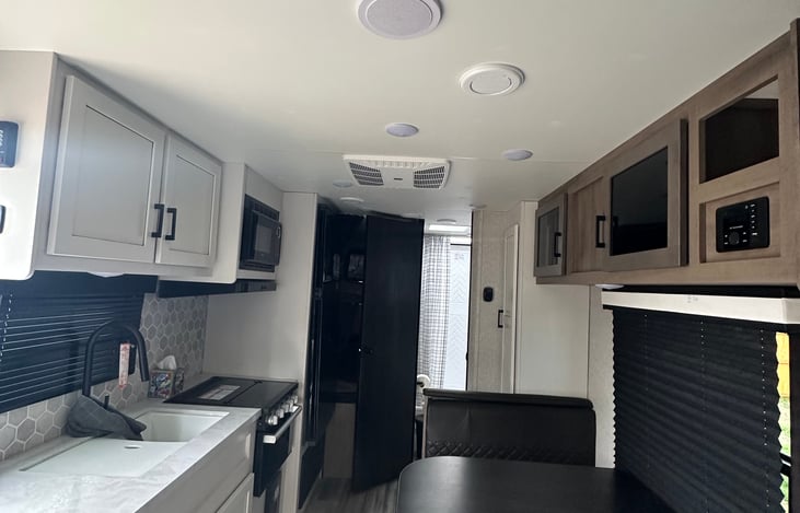 View of kitchen area and full size bunks