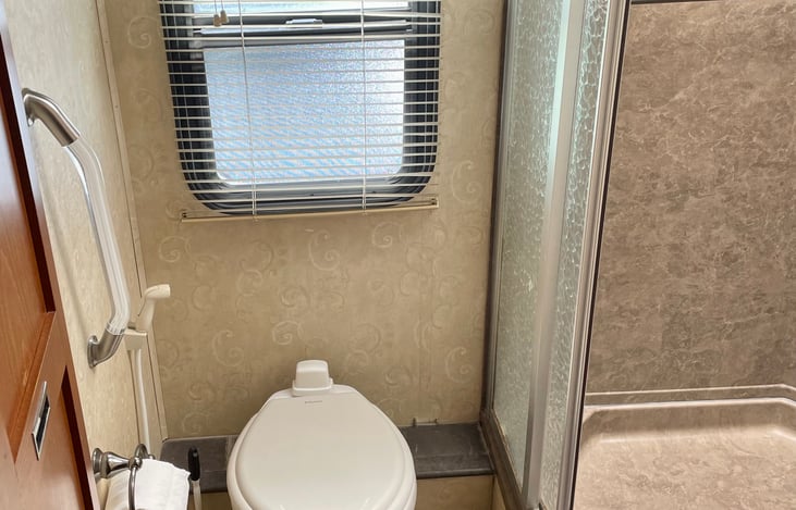 bathroom with window and skylight