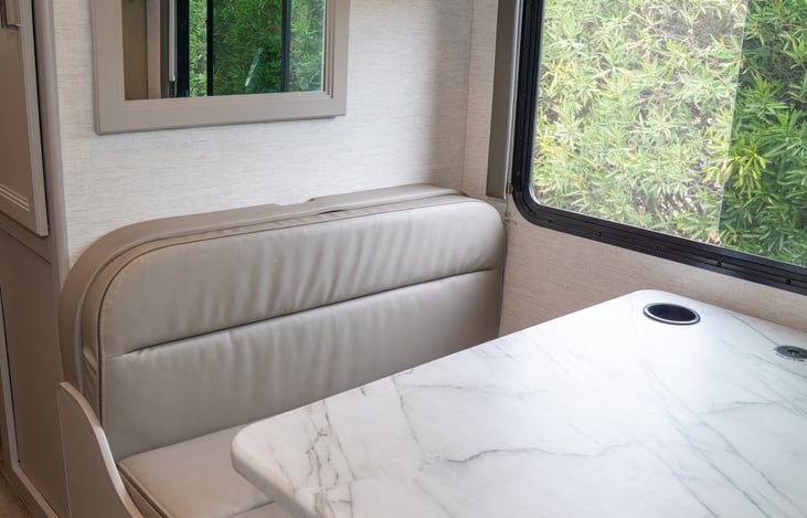 4 seater dinette with built in cup holders and wireless phone charger easily converts to a twin sized bed