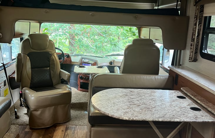 Drop down double bunk above driver and passenger seats