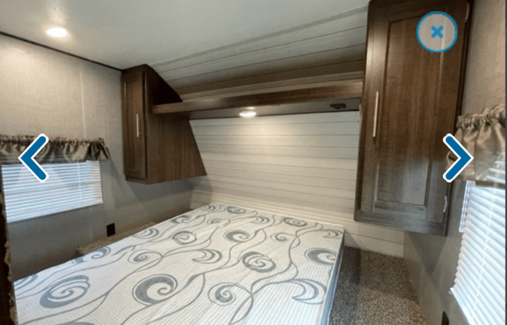 Queen bed in master room. Separate doors to close for privacy from main living area.