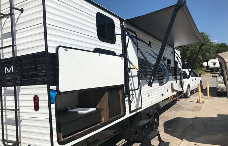 Due to unpredictable winds, awning was removed for your safety.