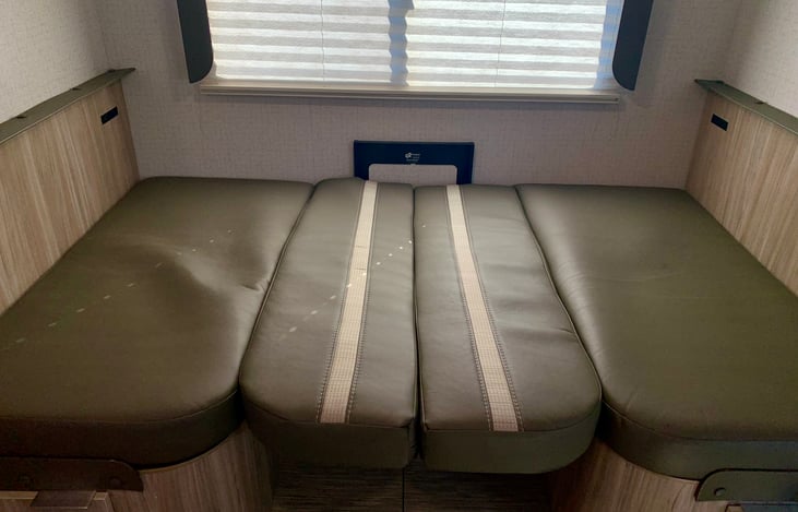 Dinette Sleeps 1 Adult or two kids. Our can be used as a nice dog bed with blanket cover.