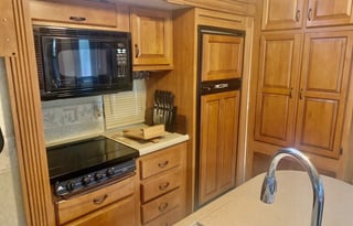 A 5th wheel travel trailer suited for 2 people