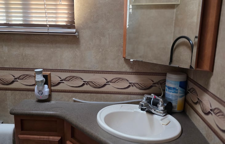 1/2 bath has plenty of storage.