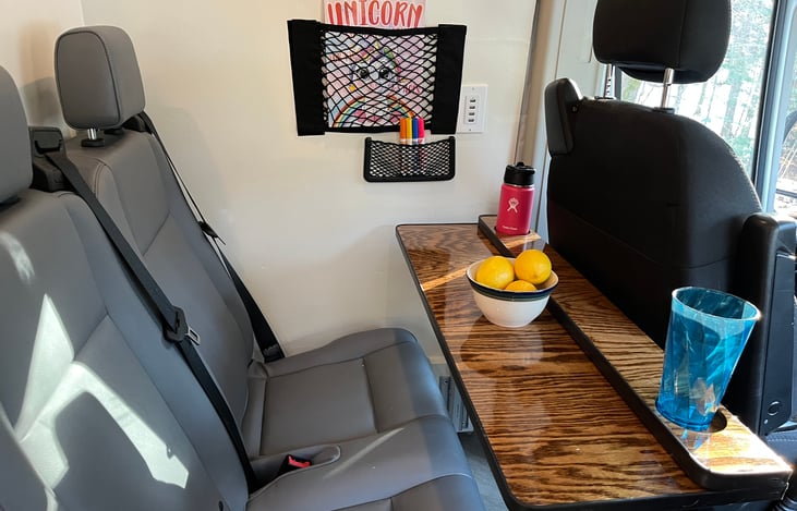 Passenger Bench seat shown with captain's chair facing forward.