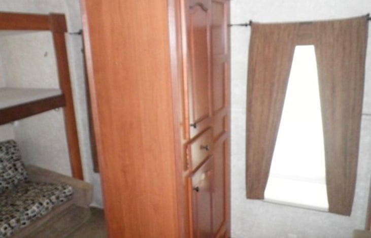 Double side cabinet storage in bunkhouse