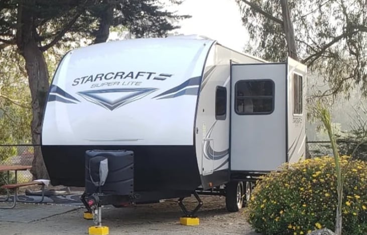 Front
2 30Lbs Propane Tanks - Electric Tongue Jack w/Light - Work Light on Front Cap. Sideout on Left Side (Drivers Side)