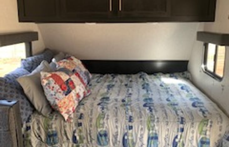 Queen sized bed with extra 2" mattress topper for added comfort.