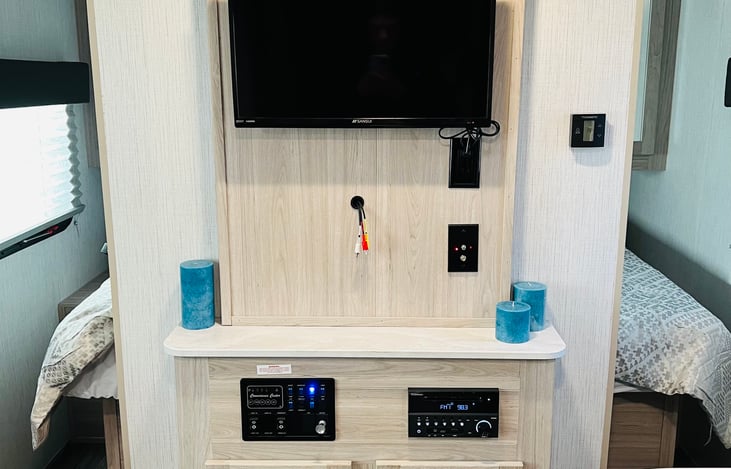 TV/ stereo w/ bluetooth and speakers inside and outside.  Heat / AC.  Campground cable hookup accessible.