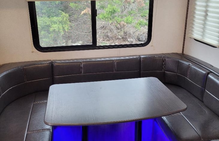 The table converts into another bed. ! or 2 children or a small adult will sleep comfortably.