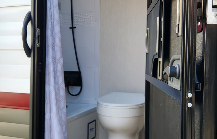 Can enter the restroom from outside the camper.