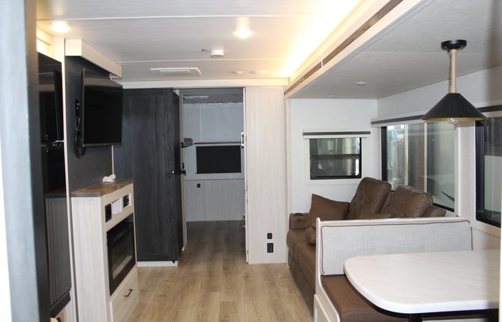 Enjoy the living room space with the kids room and 1/2 bath sectioned off with their own door for privacy.