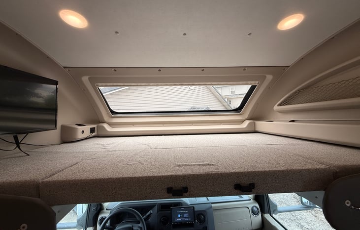 A beautiful, spacious, well lit bunk over cab.