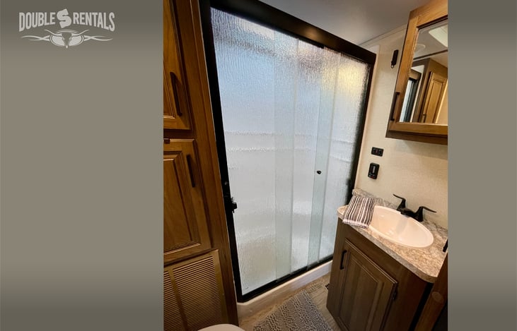 Bathroom #1 with Large Shower, Skylight and Cabinet Space