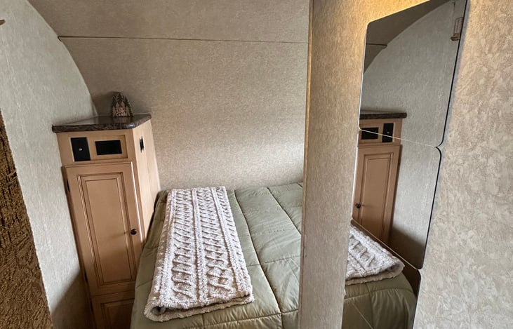 Wardrobe for clothing, full length mirror, and no-hookup pre-charged lights.