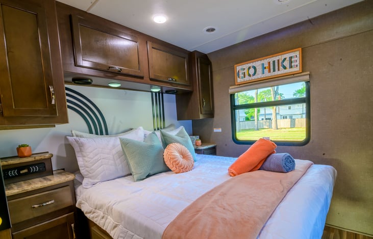 Queen size bed with ample storage.