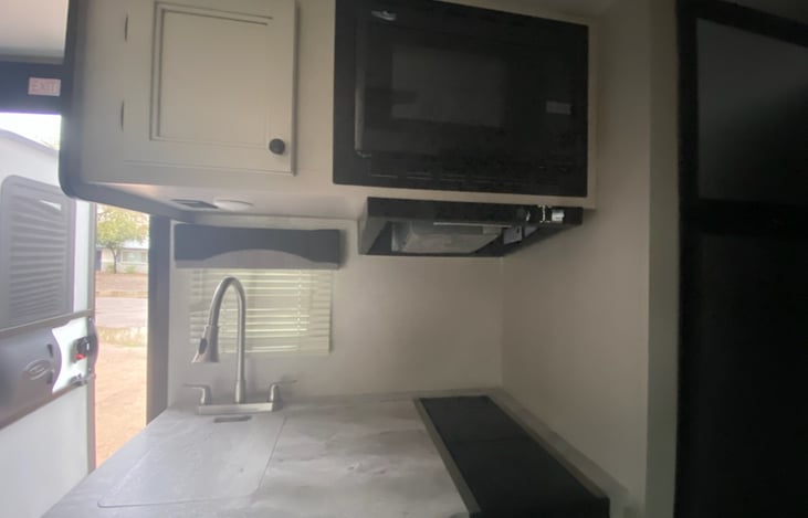 Fully stocked kitchen. Appliances include convenvection microwave, stove top, sink, refridgerator, freezer. Basic cleaning supplies are also included.