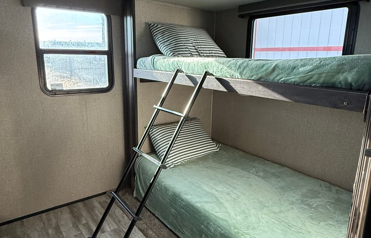 Bottom bunk has memory foam mattress, not a camper pad