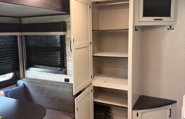 Entry way bench and pantry. Comes with an air fryer for guest to use.